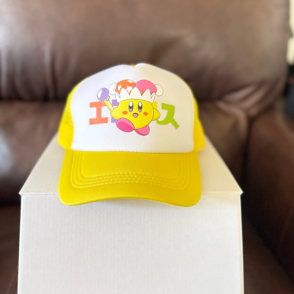 Yellow Kirby design trucker hat by Ecosys